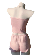 Bright & Bloom pink and white striped tube top and shorts pajama set with bow accents. Soft, breathable fabric for comfort.