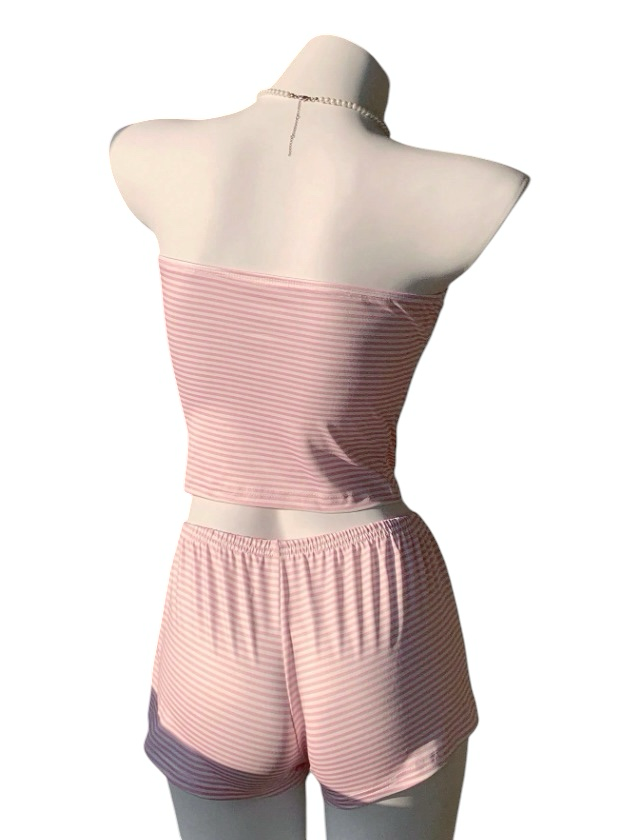Bright & Bloom pink and white striped tube top and shorts pajama set with bow accents. Soft, breathable fabric for comfort.